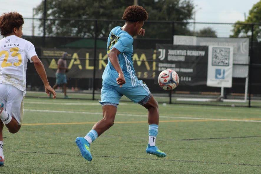 Chaz L. Grey shaping to strike the ball near the touchline
